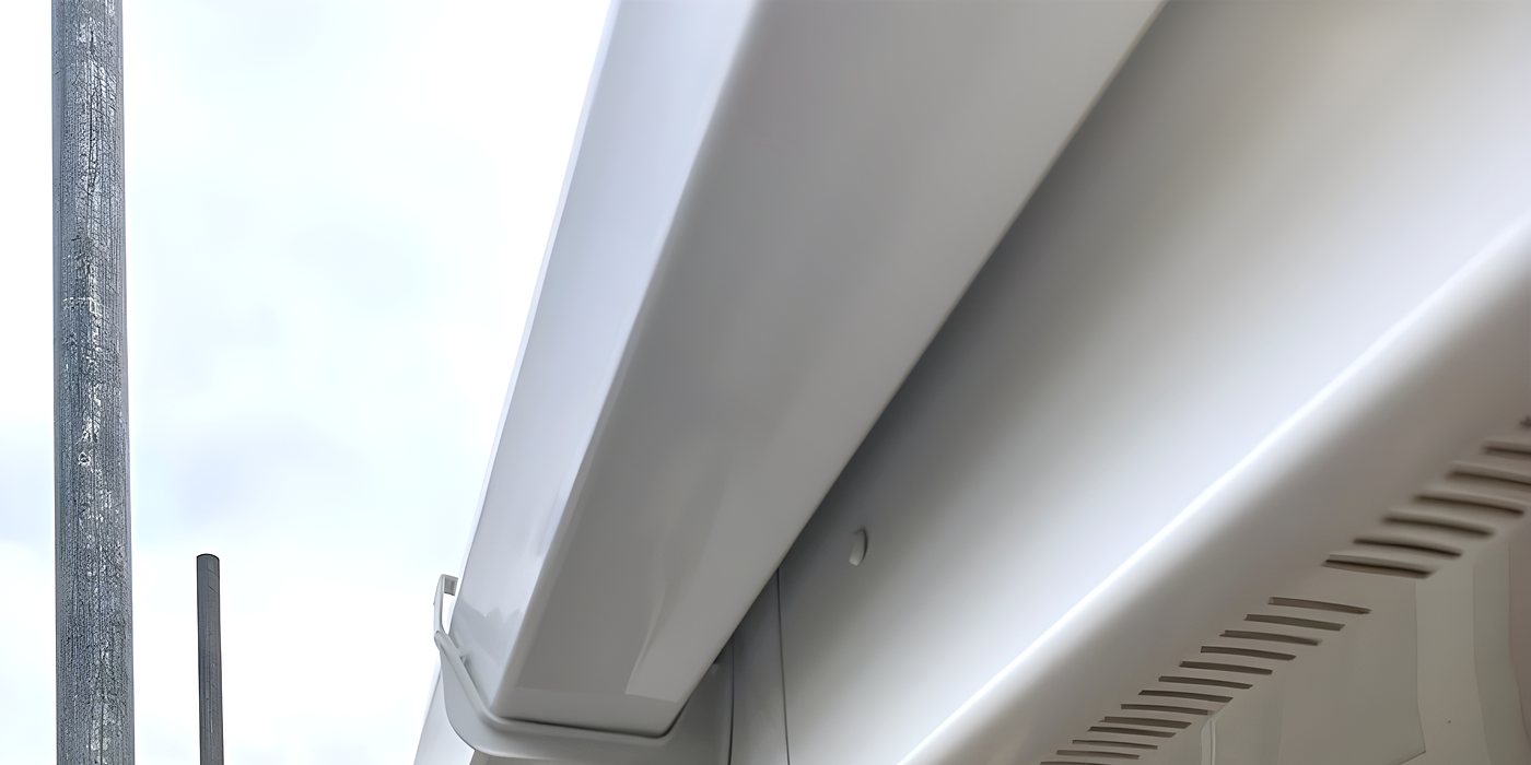 New white uPVC fascia, soffit and guttering along the eaves of a bungalow