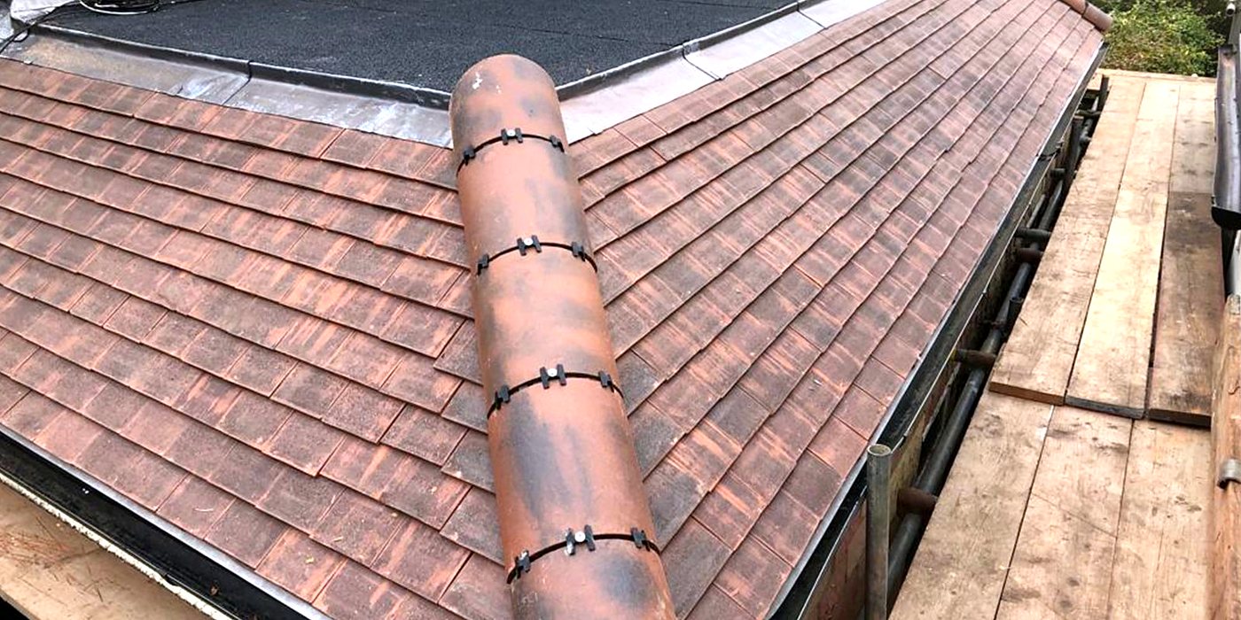 A new plain tile pitched roof and ridge, seen from above