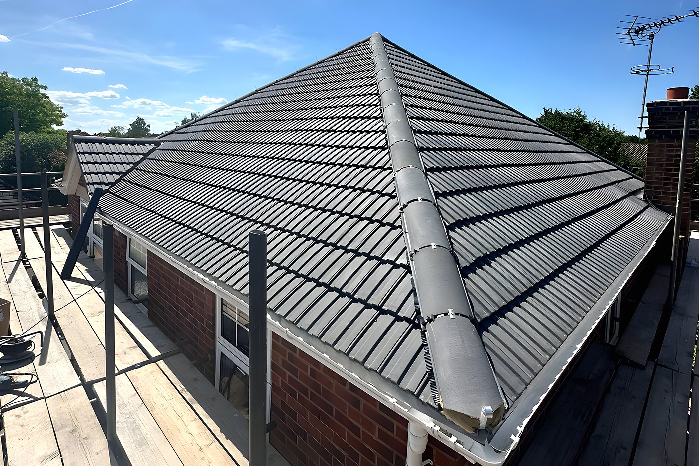 Scaffold boards around a bungalow while the roof is re-covered