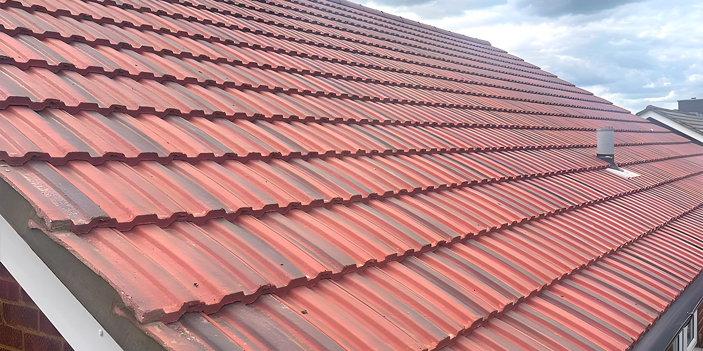 Roofing work in Crawley: a red tiled roof on a semi-detached house