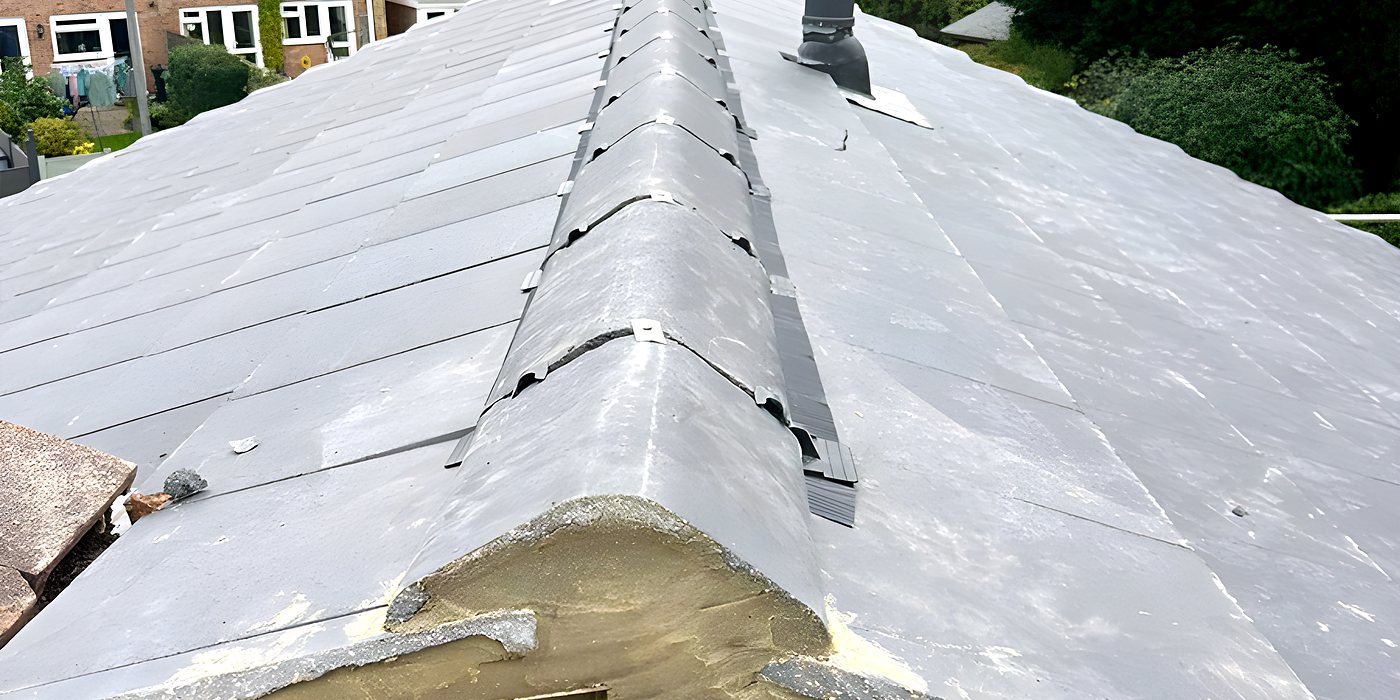 Roofing work in Haywards Heath: a grey tiled roof and its ridge seen from above